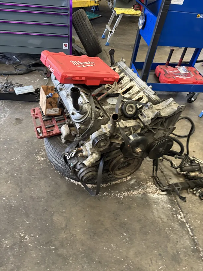 Engine pulled and set on the shop floor for rebuild